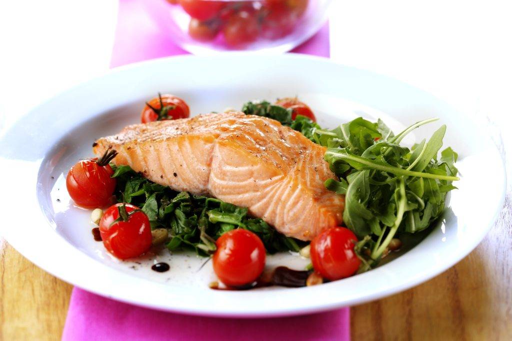 Introduction to Food Calorie Calculator salmon steak with spinach and tomatoes royalty free image 1642784078